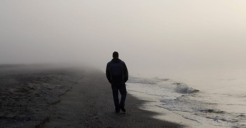 12726-lonely-man-alone-walking-beach-ocean-sea-water.800w.tn.jpg